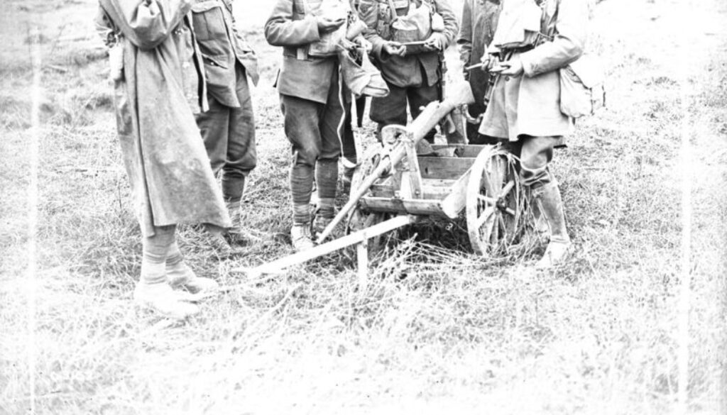 117_Canadians looking at anti-tank rifle mounted on small truck. Advance East of Arras. September, 1918.